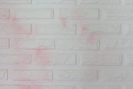 Pink and white shading color brick wall backgroundの写真素材