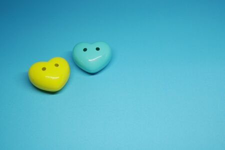 Couple ( 2 ) Blue and Yellow Heart on Blue Background - Valentine Day - Lover Concept  with Copy spaceの写真素材