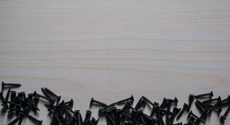 Black screw on laminate floorの写真素材