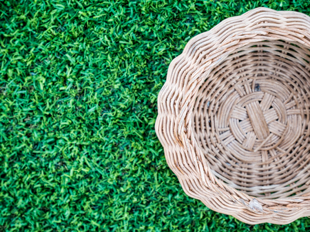 Brown basket on green grassの写真素材