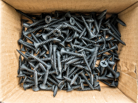 Black screw in brown boxの写真素材