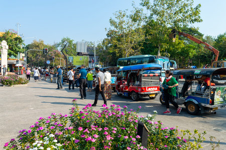 CHIANG MAI THAILAND-10 JANUARY 2020:A group of tourists who take a tuk-tuk car are getting off the...