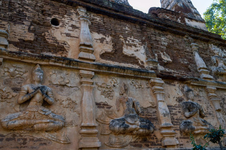 Wat Chet Yot temple,à¸ºB.E. 1998 King Bhumibol Adulyadej The 9th King of the Mangrai Dynasty built of laterite decorated with stucco designs. Is a Bodh Gaya pagoda India.の写真素材