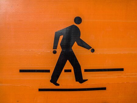 The orange-black pedestrian symbolの写真素材