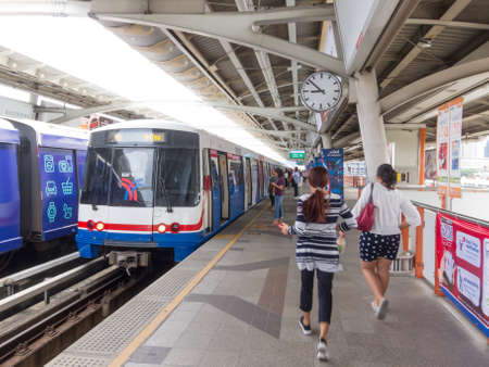 BTS Station BANGKOK,THAILAND-18 AUGUST 2018: Passengers are waiting for the train and walking to the station during the day. on, 18 AUGUST 2018, in Thailand.のeditorial素材