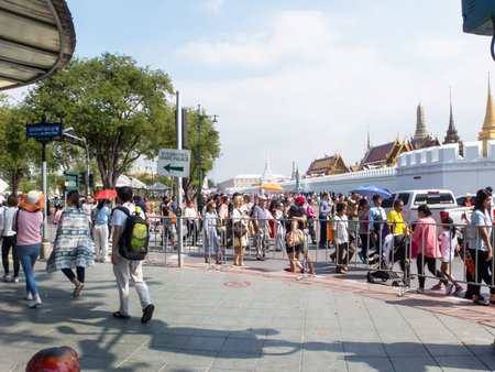 Wat Phra Kaew, Temple of the Emerald Buddha BANGKOK THAILAND-31 DECEMBER 2018:Many tourists in front...