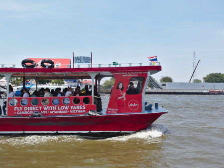 BANGKOK THAILAND-08 APRIL 2019.:The red ferry sails on the Chao Phraya River.