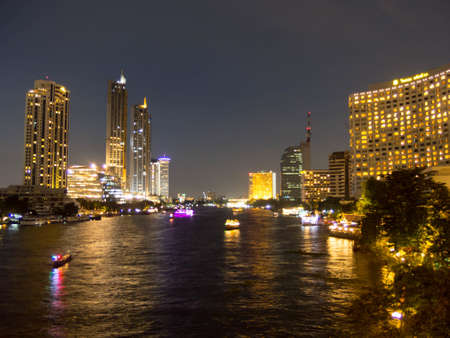 View of the Chao Phraya River City Scape BANGKOK,THAILAND-16 OCTOBER 2018:Chao Phraya River At night, there is light from the ICONSIAM building and the boat sailing . on,16 OCTOBER 2018, in Thailand.のeditorial素材