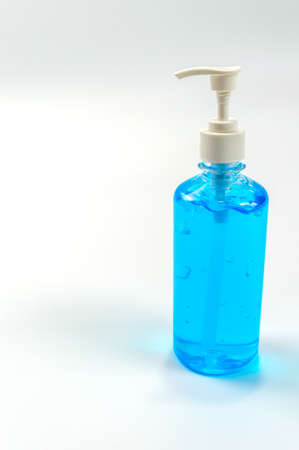 Alcohol gel bottles for hand washing. Disinfecting alcohol. Handwashing alcohol has a clear blue color on a white background.の写真素材