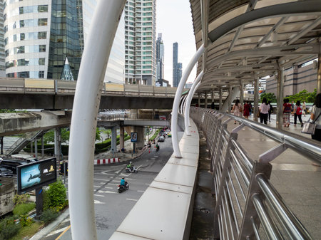 Chong Nonsi, Bangkok-15 September 2020: Office workers leaving work Walking through the Skywalk to...