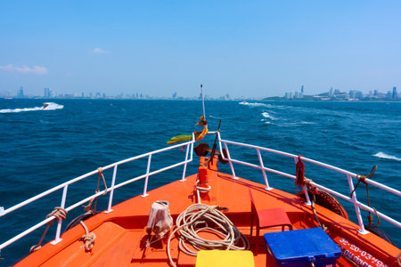 Landscape of Pattaya Bay and Pattaya city during the daytime with speedboat tour boats moored in the bay.の写真素材