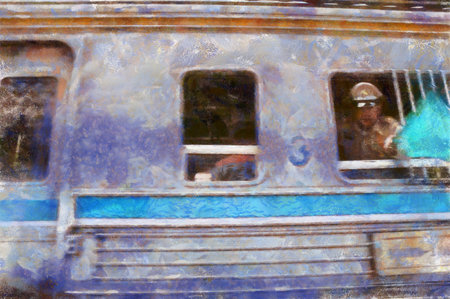 Third-class train passengers wait for their train at the station.の写真素材