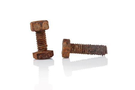 Dirty Old rusty bolt and nut on a white background.の写真素材