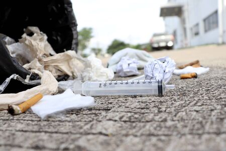 Full garbage spread on the side of the roadの写真素材