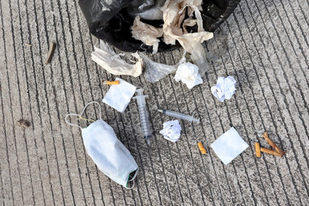Full garbage spread on the side of the road