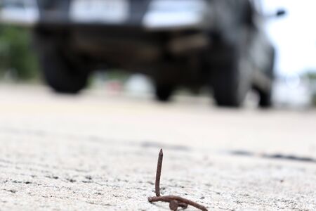 Sharp nails on the roadの写真素材