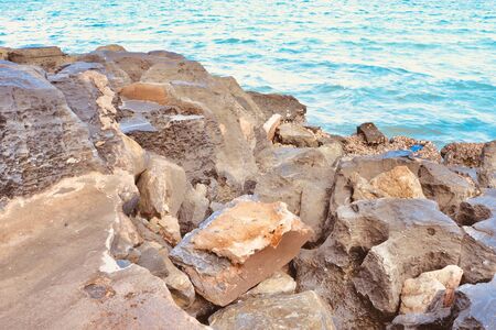 Hole on the stone surface by the sea at Thailandの写真素材