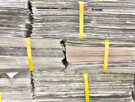 Old newspapers lined up in the officeの写真素材