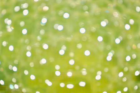 Bokeh images made from water and blurred in green tonesの写真素材