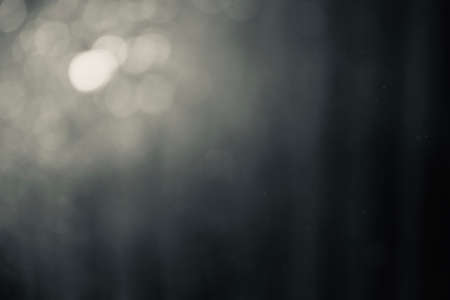 Bokeh images and blur made from water droplets at nightの写真素材