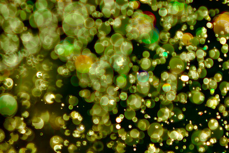 Blurred images and bokeh made from water droplets in green and yellow tones