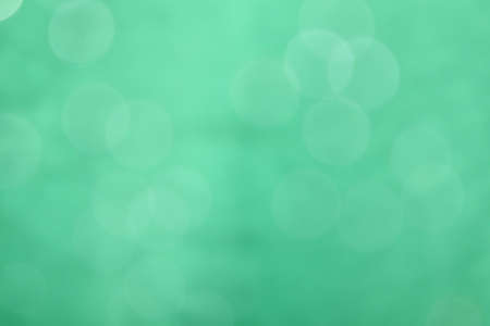 Blurred images and bokeh made from water droplets in green tonesの写真素材