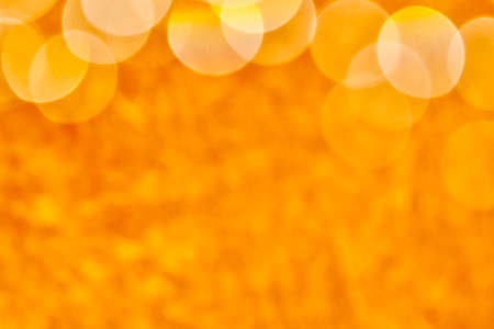 Blurred images and bokeh made from water droplets in orange tonesの写真素材