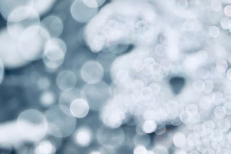 Blurred images and bokeh made from water droplets in cool tonesの写真素材