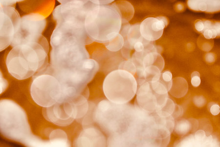 Blurred images and bokeh made from water droplets in orange tones