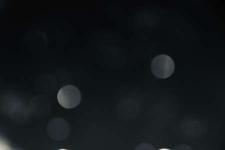 Blurred images and bokeh made from water droplets in black and white tonesの写真素材