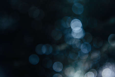 Blurred images and bokeh made from water droplets in cool tonesの写真素材