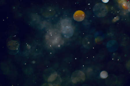 Blurred images and bokeh made from water droplets in black and white tonesの写真素材