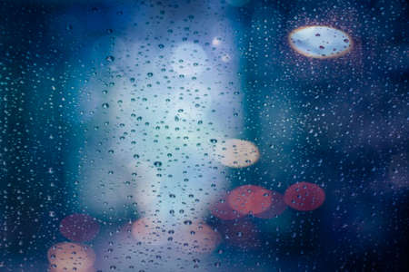 Bokeh and water droplets on glassの写真素材