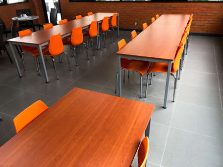 Tables and chairs in an empty atmosphereの写真素材