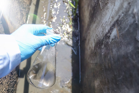 Collect water samples in industrial canals for examination