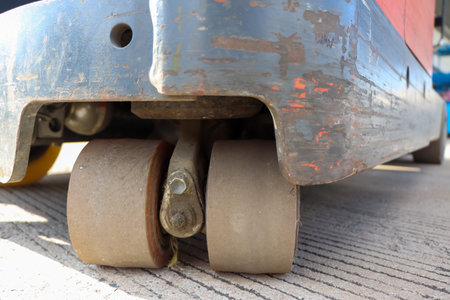 Stand-up electric forklift wheels and oldの写真素材