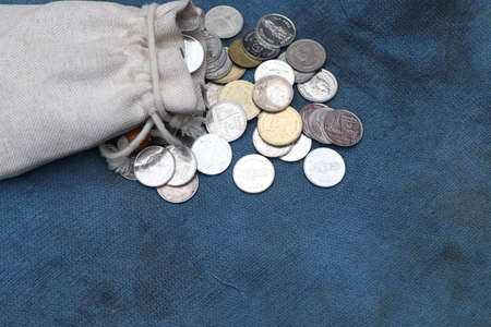 Money and money bag on old clothの写真素材