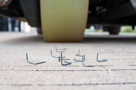 Nail trap and sharp on the roadの写真素材