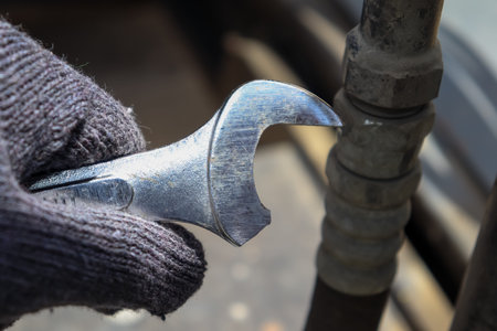 The maintenance worker's wrench is broken after being used