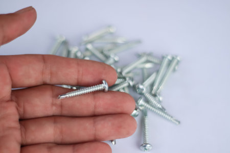 Screws on a white background industrial maintenance equipment