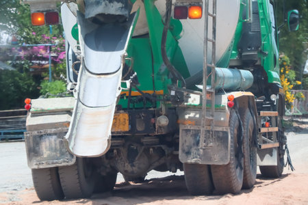 Build a road using cement truck at day