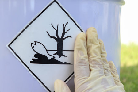 Labeling a sign on a chemical tankの写真素材