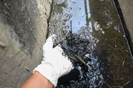 Black water in an industrial canalの写真素材