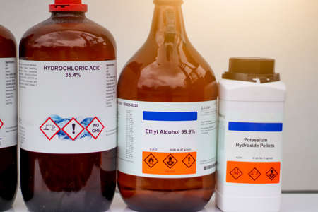 hydrochloric acid, ethyl alcohol, potassium hydroxide pellets, laboratory chemicals and hazardsの写真素材