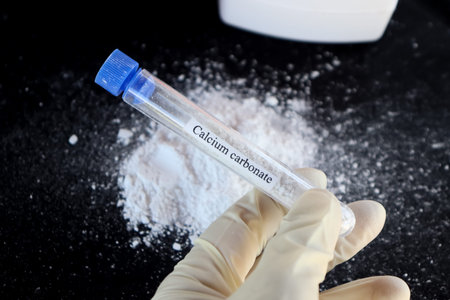 Calcium carbonate in test tube and black background