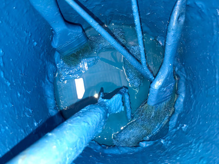 Blue mixing tank for painter and tools for work
