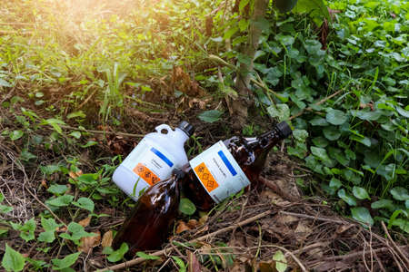 Chemical bottles from the industry or laboratory and destroy natureの写真素材