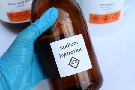 Sodium hydroxide in bottle, chemical in the laboratory and industry