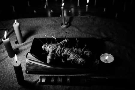 Candle light in the dark and curse doll, candle light ceremonyの写真素材