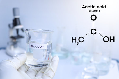 acetic acid in glass, chemical in the laboratory and industry, corrosive chemicalの写真素材